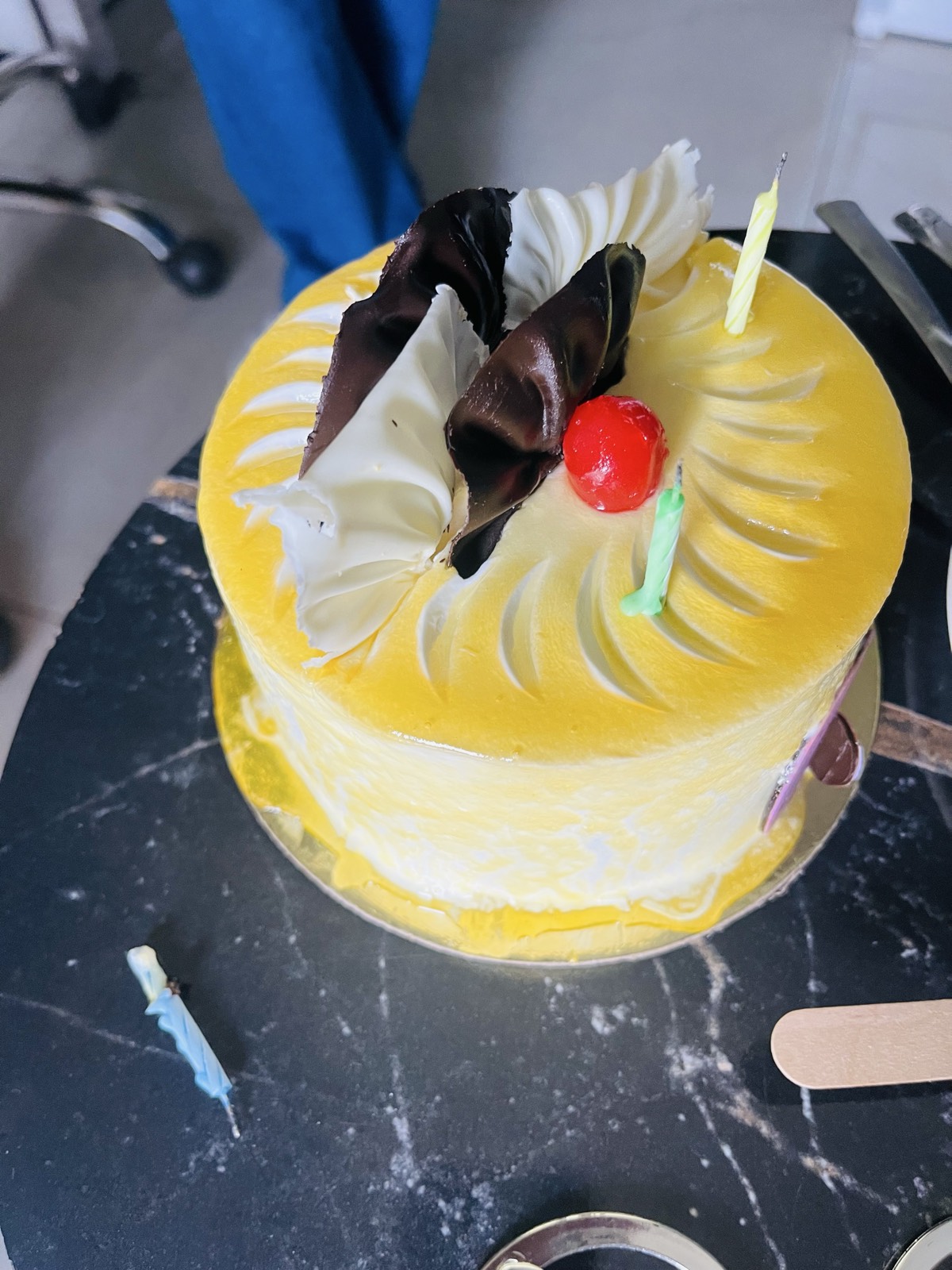 Yellow Birthday Cake with Chocolate Curls and Cherry